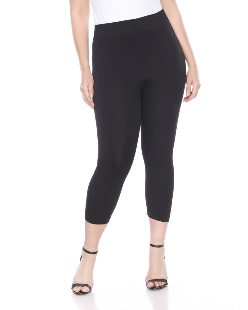 Front of a model wearing a size one-size-fits-all Super Soft Capri Leggings in Black by White Mark. | dia_product_style_image_id:249373